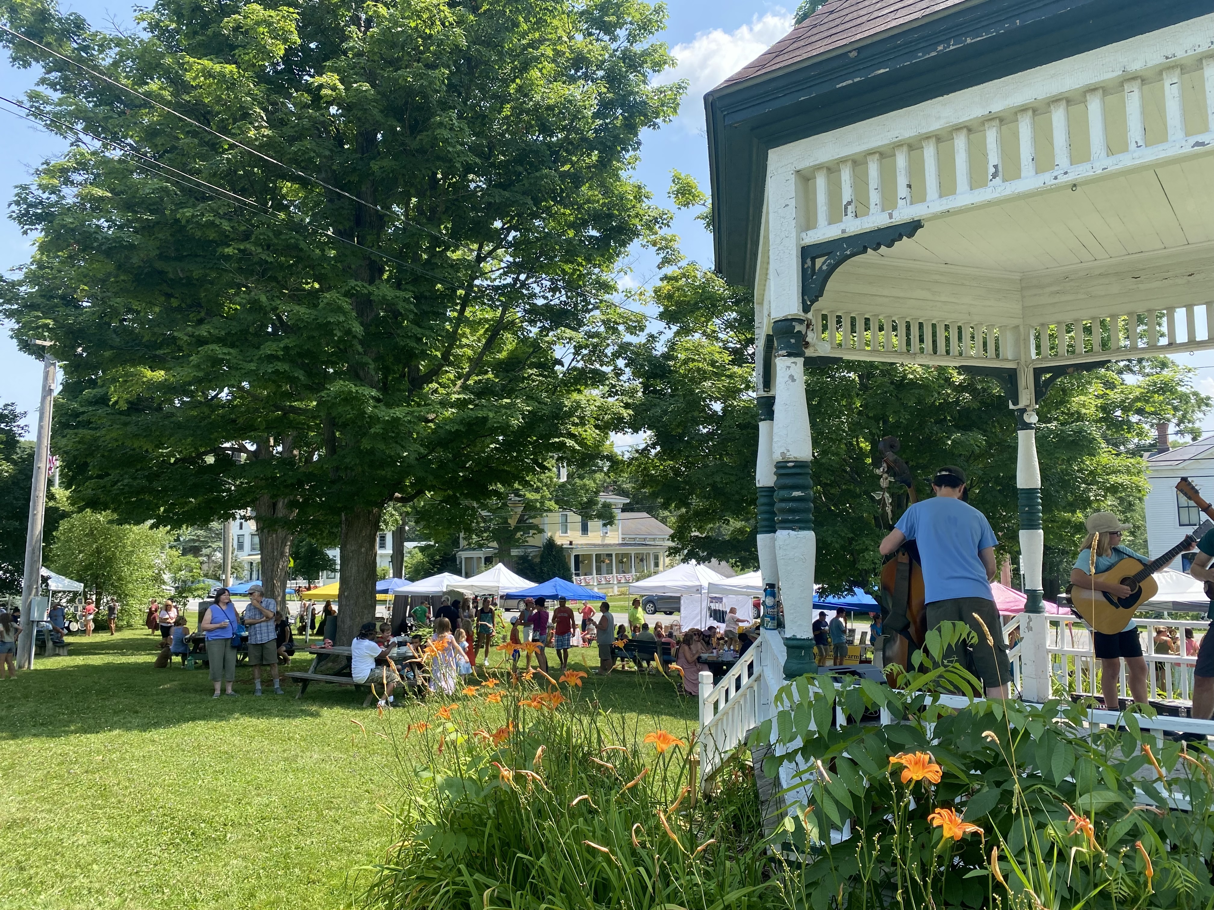 View past a gazebo to tents set up for a Food & Farm Fest.